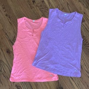 Two Under Armour heat gear workout tops